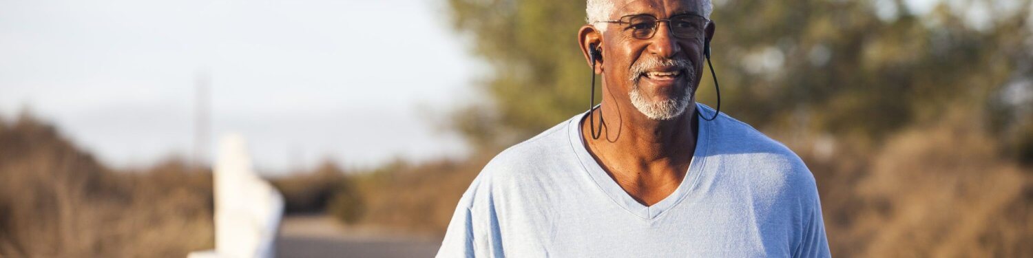 Older gentleman with ear phones in