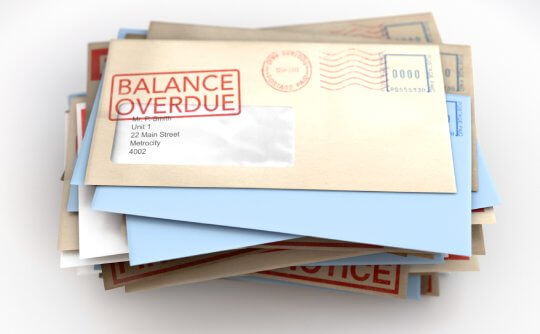 Mail with balance overdue stamped on it