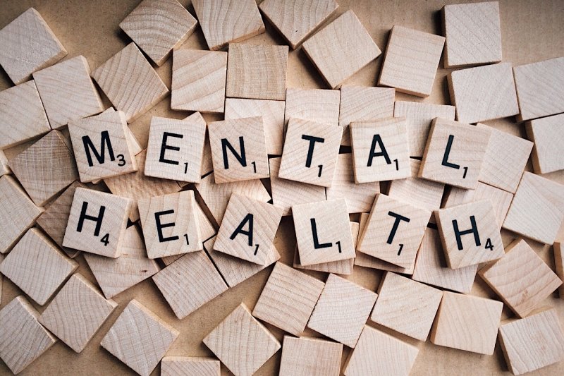 Wooden tiles spelling out mental health.